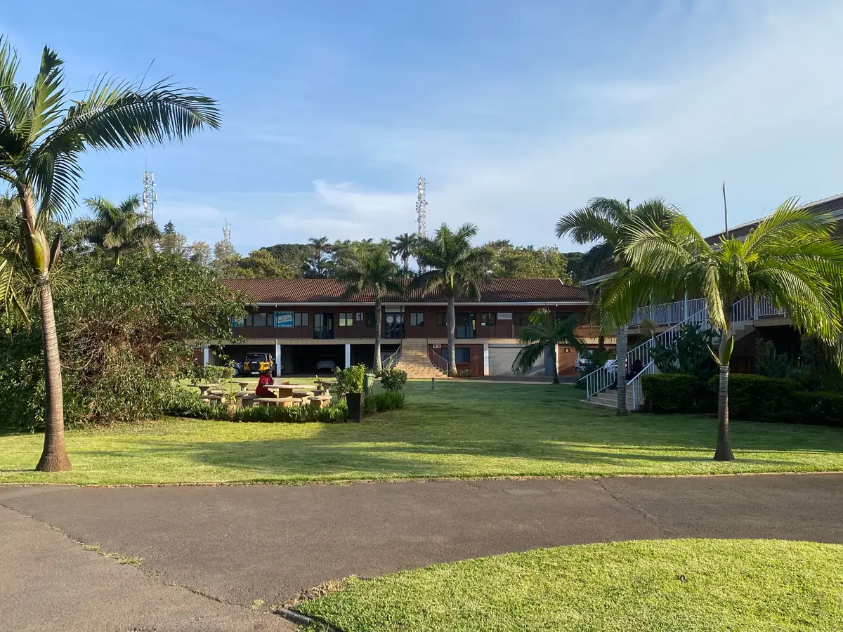 Central lawn and seating area between the blocks at Rey Park, Ballito