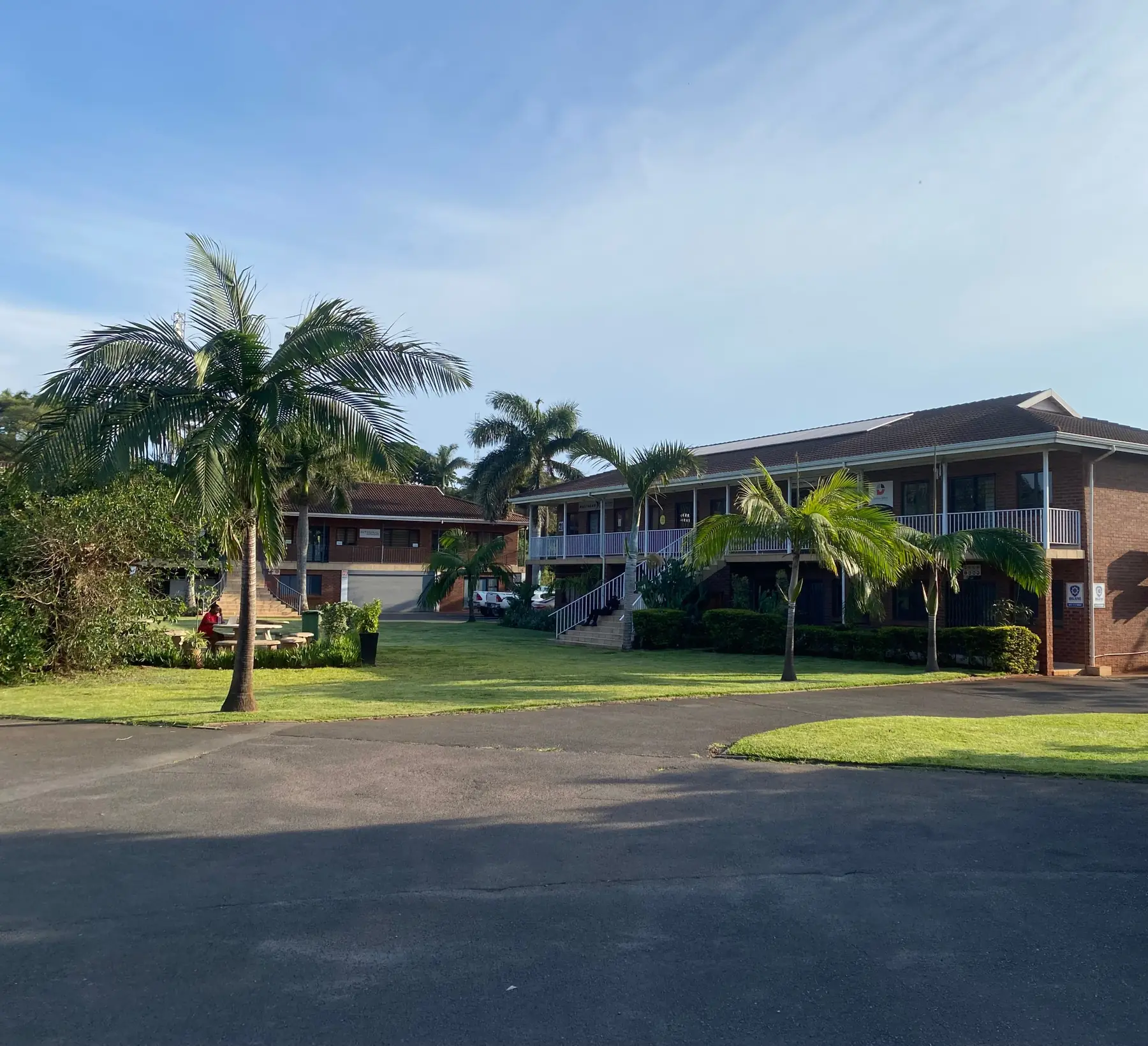 Two-storey brick office block with palms and lawns at Rey Park, Ballito